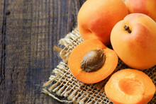 Fresh Ripe Apricots On A Rustic Wooden Table