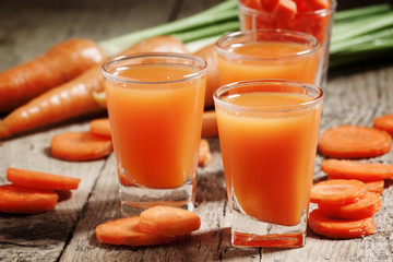 Wall Mural - Fresh carrot juice in the glass, selective focus