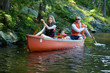 © sianc - family paddling a canoe on a wilderness lake