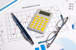 © Di Studio - close up of business plan with graphs, charts, glasses, pen and