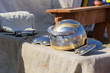 Ancient Roman helmet and ax on table