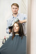 © Ravil Sayfullin - Young woman having her haircut by a handsome hairdresser