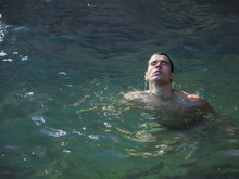 Attractive Young Shirtless Athletic Man Emerging From Water
