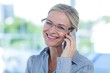 © WavebreakmediaMicro - Smiling businesswoman having a phone call