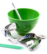 Dental metal impression trays, dental green flask, spatula, pins isolated on white