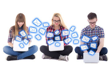 internet chat - two teenage girls and one boy sitting with lapto