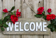 Welcome sign with red roses border