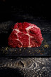 © Westend61 - Raw beef and pepper on dark wood
