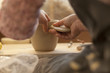 © Westend61 - Potter in workshop working on earthenware pot