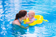 © famveldman - Mother and baby in a swimming pool