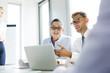 © Westend61 - Business people in workshop developing new ideas