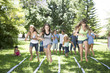 © Westend61 - Girls competing in an egg-and-spoon race