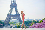 Fototapeta Paryż - Beautiful young woman in Paris