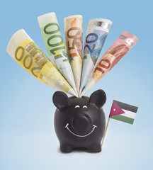 Various european banknotes in a happy piggybank of Jordan.(serie