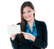 © iPortret - Happy businesswoman finger pointing at blank card against white background