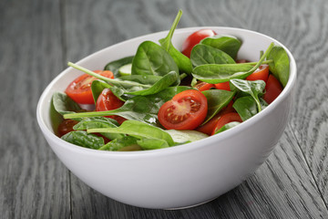 Wall Mural - fresh summer organic salad with tomatoes cucumbers and spinach