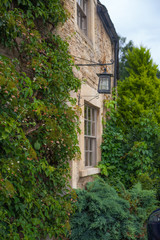 Wall Mural - CHIPPENHAM, UK - AUGUST 9, 2014: Castle Combe, unique old English village. Old house