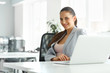© puhhha - Beautiful Businesswoman in Her Office working on Laptop Computer
