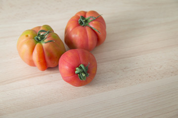 Three fresh raw tomatoes