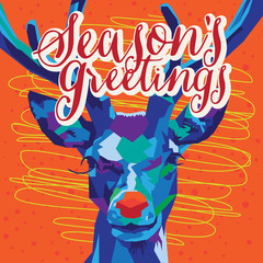 Wall Mural - Blue and Purple Geometric Reindeer on Orange background with Seasons Greetings Text