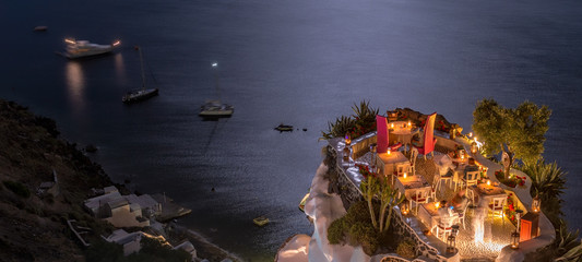 Terrace in front of the ocean. Restaurant with sea view at night