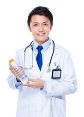 Wall Mural - Male doctor hold with water bottle