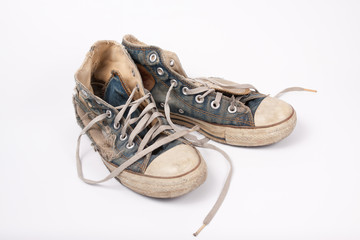 Old & Torn shoes isolated on white background