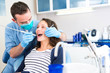 © Production Perig - Young attractive woman being cured by a dentist