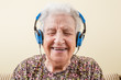 © berna_namoglu - senior woman wearing headphones