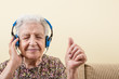© berna_namoglu - senior woman listening music