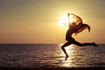 Poster - Happy girl jumping on the beach