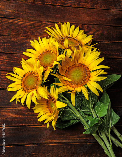 Plakat na zamówienie sunflowers on a wooden background