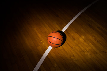 Wall Mural - Basketball ball over floor in the gym