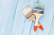 Paintbrush over blue wood