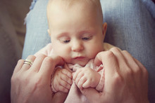 Infant Girl Holding Fathers Hands