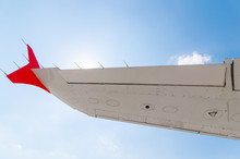 Wing Of The Plane On Blue Sky Background , View Under Aircraft