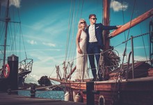 Stylish Wealthy Couple On A Luxury Yacht