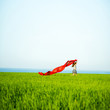 © mr.markin - Young happy woman in wheat field with fabric. Summer lifestyle
