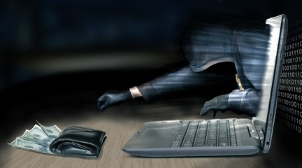 Wall Mural - anonymous thief - hacker steals money from laptop