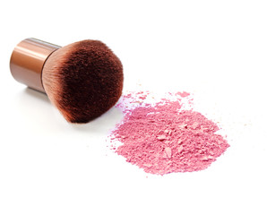 Cosmetic powder brush and crushed blush palette isolated on white