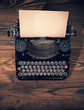 Retro typewriter on wooden planks