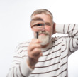 © kostyha - Old man with a beard with a magnifying glass