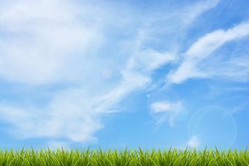 Grass grass under blue sky and clouds