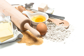 Baking ingredients flour, eggs. Wooden kitchen utensils. Food ba