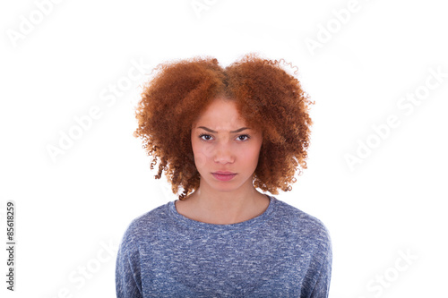 Young Angry African American Teenage Girl Isolated On White Back