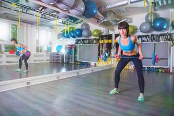 Pulling barbell on a gym