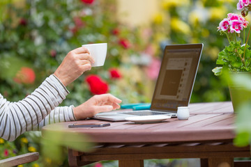 Woman with notebook on the garden