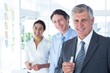 © WavebreakmediaMicro - Smiling business people brainstorming together