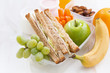 school lunch with sandwiches and fruit, close-up