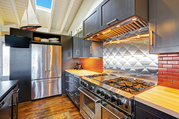 Wall Mural - Luxury beautiful dark modern kitchen with vaulted wood ceiling.